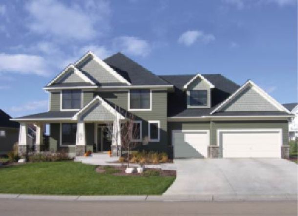 Modern contemporary house with white garage doors.
